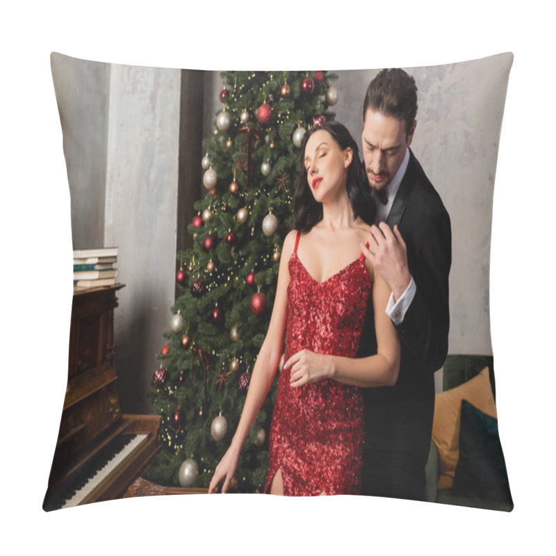 Personality  Handsome Man In Tuxedo Hugging Attractive Wife In Red Elegant Dress Near Christmas Tree And Piano Pillow Covers