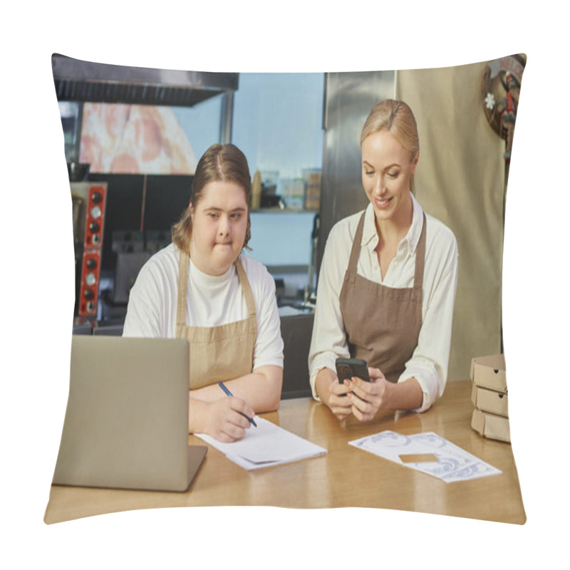 Personality  Young Woman With Mental Disability Writing Order Near Laptop And Manager With Smartphone In Cafe Pillow Covers