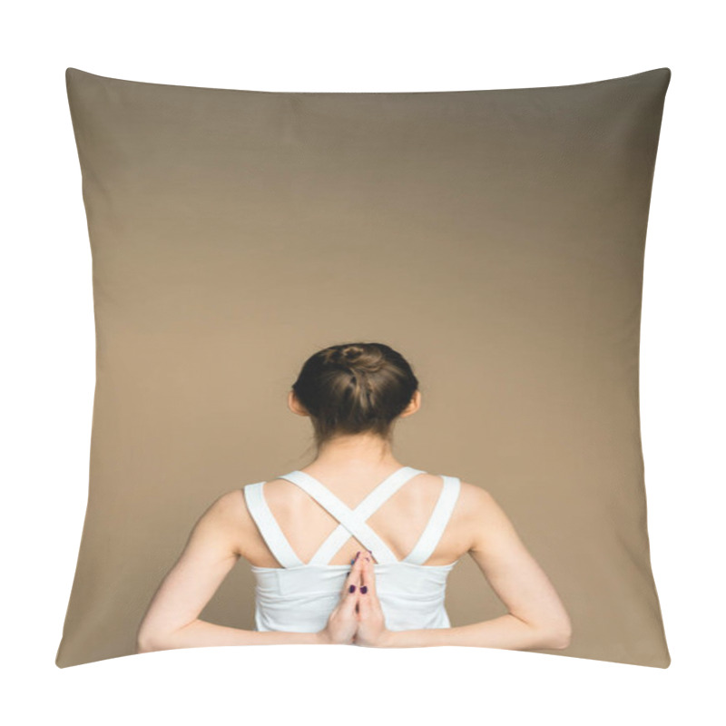 Personality  A Woman Holds Her Hands Behind Her Back And Practices Yoga On A Beige Background. A Beautiful Young Girl Is Meditating In The Pose Of Parshvottanasana. Pillow Covers