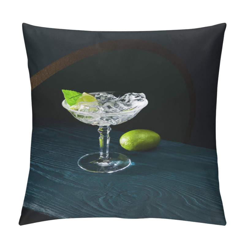 Personality  High Angle View Of Cocktail Glass With Mint Leaf And Whole Lime On Blue Wooden Surface On Geometric Background Pillow Covers