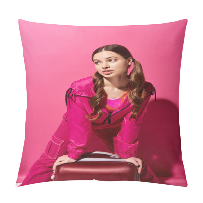 Personality  A Stylish Young Woman In Her 20s Sits On The Ground With A Suitcase, Exuding A Sense Of Wanderlust And Adventure Against A Pink Background. Pillow Covers