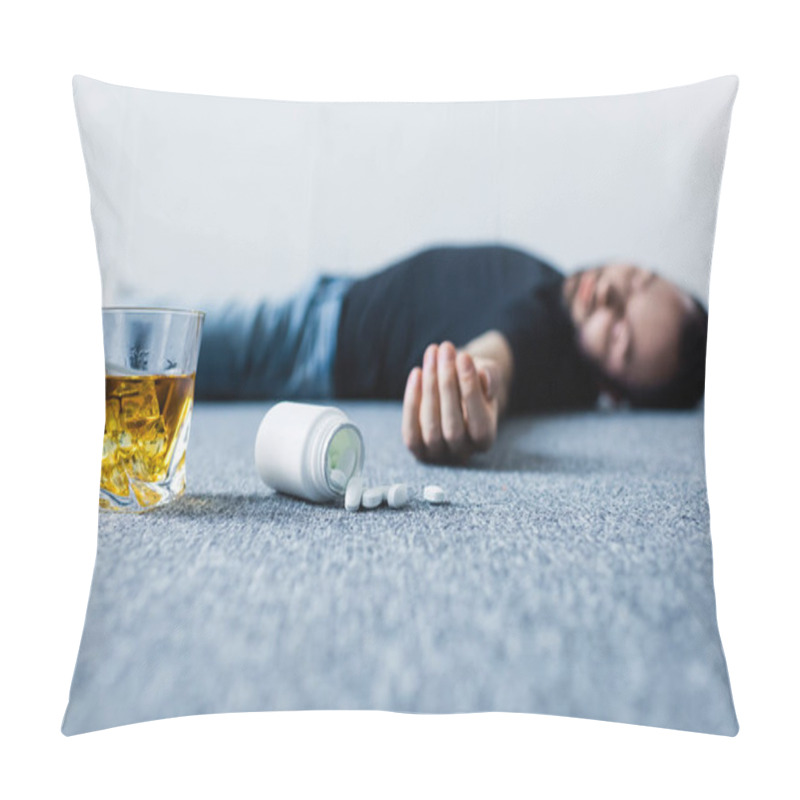 Personality  Selective Focus Of Unconscious Man Lying On Grey Floor Near Glass Of Whiskey And Container With Pills  Pillow Covers