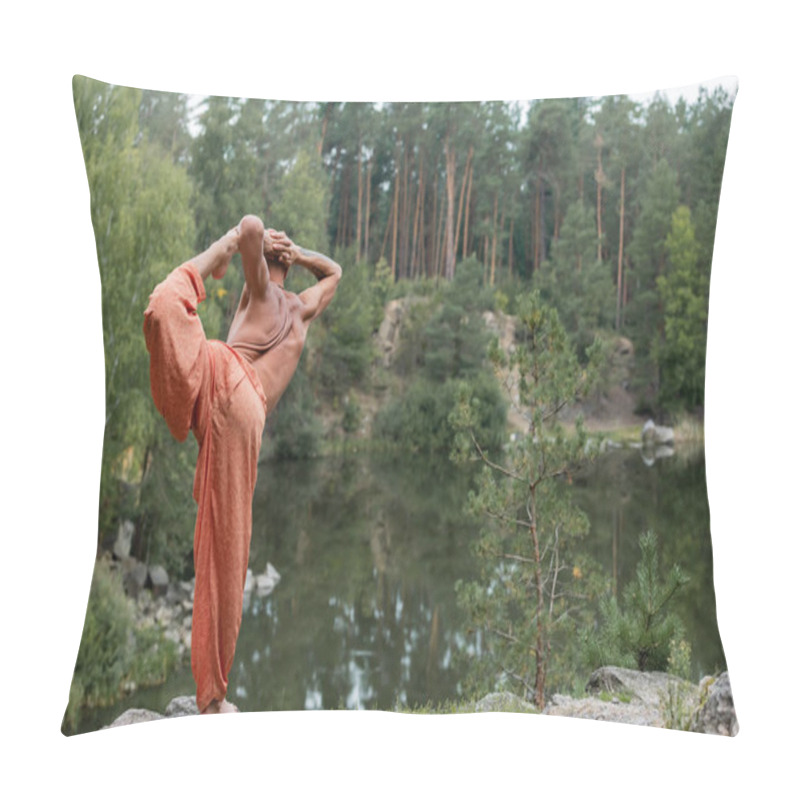 Personality  Back View Of Shirtless Buddhist Practicing Standing Bow Pose On Rock Over Lake Pillow Covers