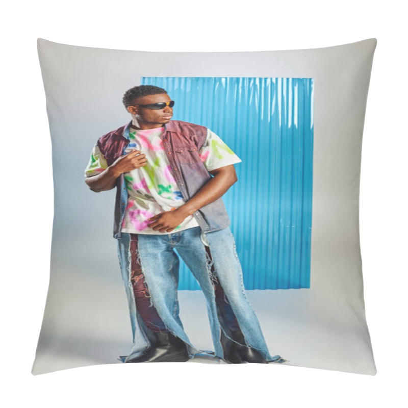 Personality  Full Length Of Fashionable Afroamerican Model In Sunglasses, Ripped Jeans And Colorful Denim Vest Posing On Grey With Blue Polycarbonate Sheet At Background, Sustainable Fashion, DIY Clothing Pillow Covers