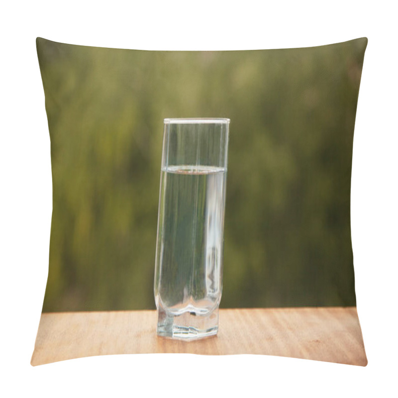 Personality  Pure Cold Water In A Glass Cup Stands On A Wooden Table In The Street Against The Background Of Green Trees. Life Style Pillow Covers