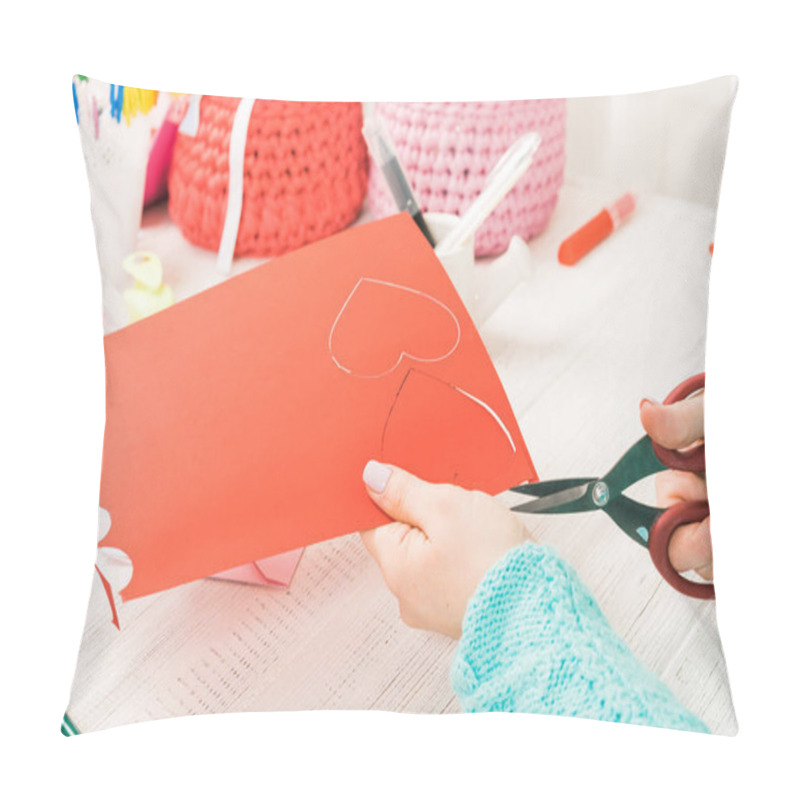 Personality  Valentine's Day Theme. Female Hands Cut The Heart Out Of The Paper. Packed Gifts, Tools On A Battered Wooden Table. Workplace For The Preparation Of Handmade Ornaments Pillow Covers