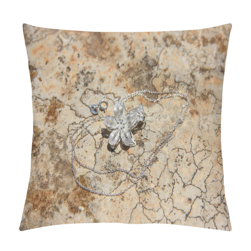 Personality  Traditional Maltese Souvenir - Gentle Silver Flower Filigree Jewelery With Thin Chain On Textured Stone Surface Close-up Pillow Covers