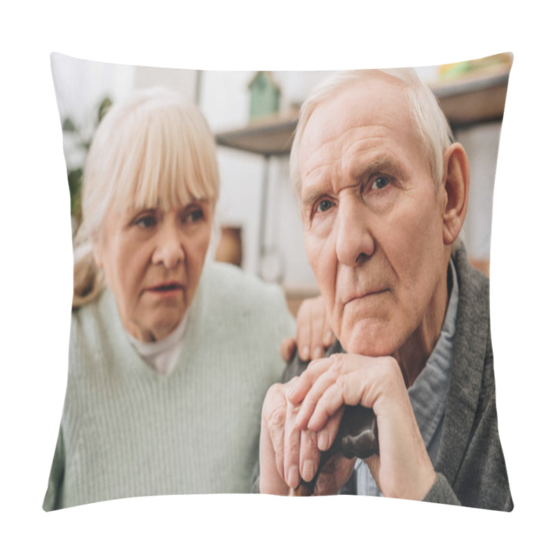 Personality  Selective Focus Of Sad Pensioner Sitting Near Retired Wife At Home  Pillow Covers