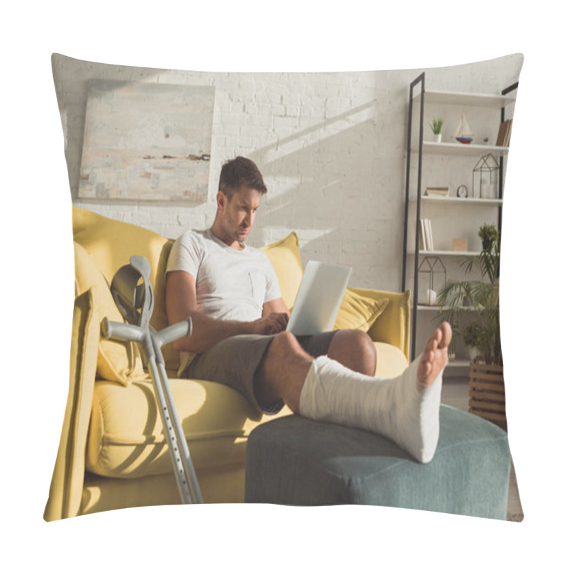 Personality  Handsome Man With Broken Leg Using Laptop Near Crutches On Sofa Pillow Covers