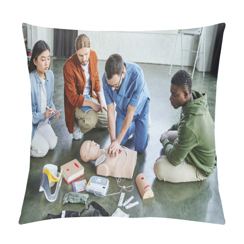 Personality  First Aid Seminar, Multiethnic Team Looking At Medical Instructor Doing Chest Compressions On CPR Manikin Near Defibrillator, Wound Care Simulators, Neck Brace, Bandages And Compression Tourniquets Pillow Covers