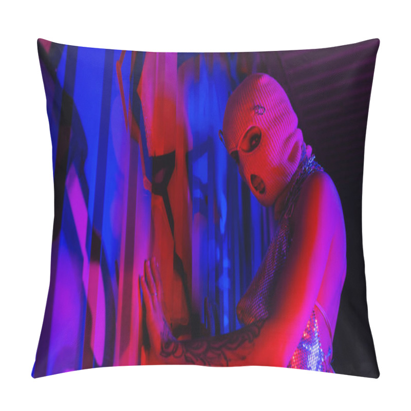 Personality  Woman In Balaclava Touching Blue Wall With Graffiti While Looking At Camera In Red Lighting Pillow Covers