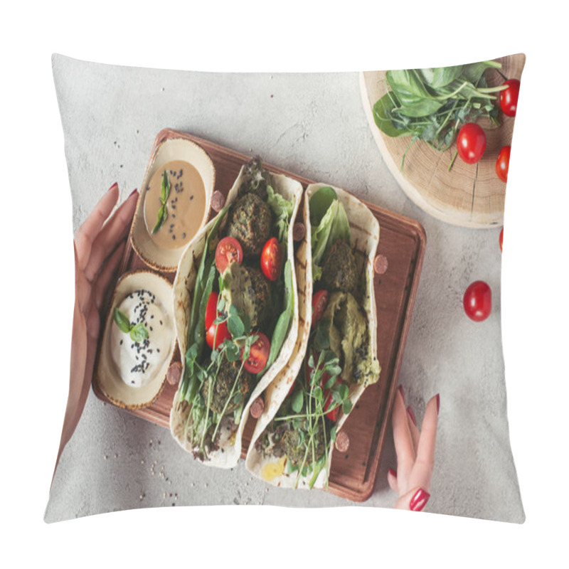 Personality  Cropped Shot Of Woman Holding Falafel With Tortillas, Cherry Tomatoes And Germinated Seeds Of Sunflower Served On Wooden Board On Grey Surface Pillow Covers