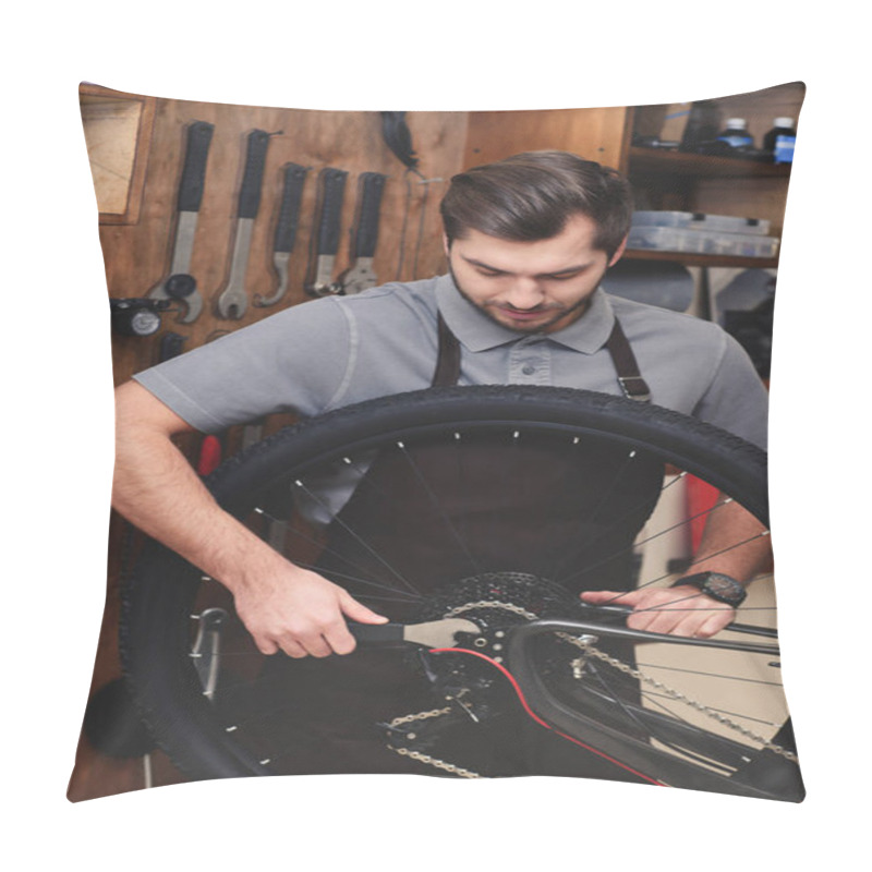 Personality  Young Man In Apron Fixing Bicycle Wheel And Chain With Wrench In Workshop Pillow Covers