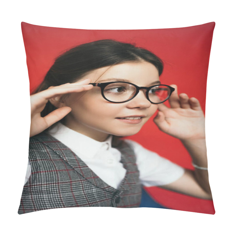 Personality  Preteen Girl Adjusting Eyeglasses And Smiling While Looking Away Isolated On Red Pillow Covers