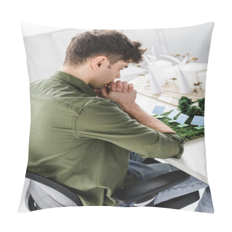 Personality  Handsome Architect Sitting On Chair At Table With Trees, Windmills, Buildings And Solar Panels Models In Office Pillow Covers