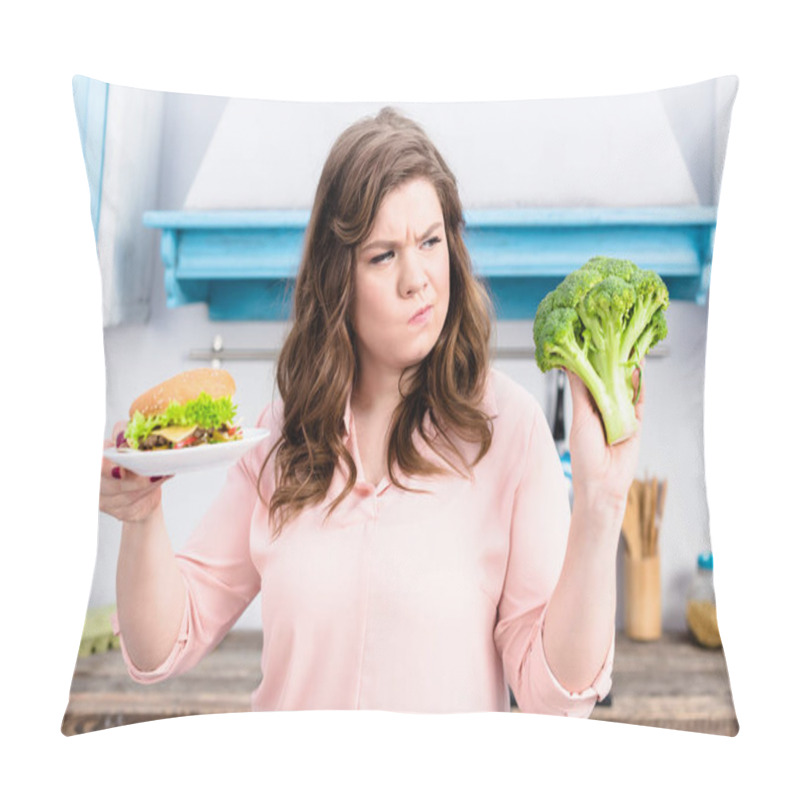 Personality  Portrait Of Overweight Woman With Burger And Fresh Broccoli In Hands In Kitchen At Home, Healthy Eating Concept Pillow Covers