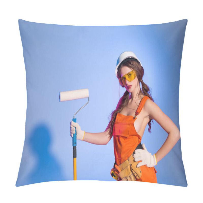 Personality  Seductive Girl In Overalls And Safety Helmet With Tool Belt Holding Painting Roller, On Blue Pillow Covers