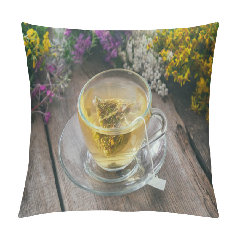 Personality  Glass Tea Cup With Tea Bag Of Healthy Herbal Tea And Bunches Of Medicinal Herbs On Background, Not In Focus. Pillow Covers