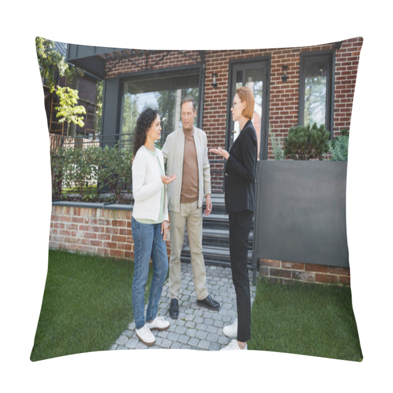 Personality  Realtor In Glasses Gesturing While Talking With African American Woman Near Husband And Modern House Pillow Covers