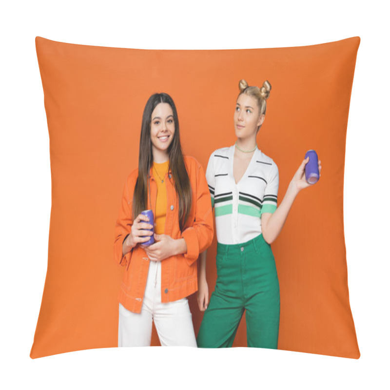 Personality  Smiling Brunette Teenage Girl In Trendy Outfit Holding Drink In Tin Can And Looking At Camera Near Blonde Girlfriend On Orange Background, Fashionable Girls With Sense Of Style Pillow Covers