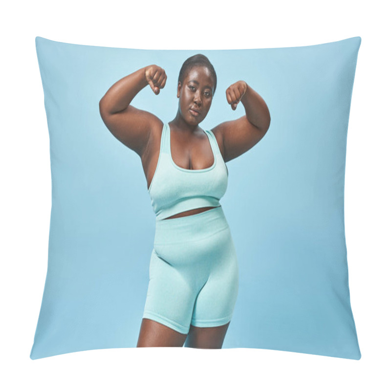 Personality  Serious Plus Size Woman In Active Wear Flexing Her Muscles And Looking At Camera On Blue Background Pillow Covers