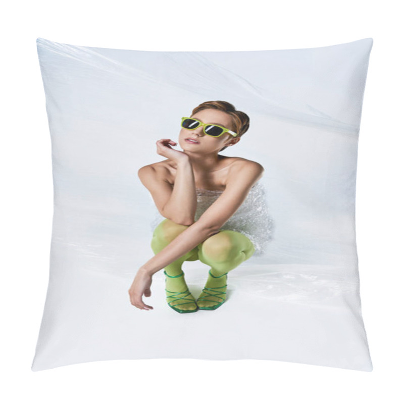 Personality  A Woman In A Green Outfit And Sunglasses Poses While Sitting Amidst Plastic Sheeting. Pillow Covers