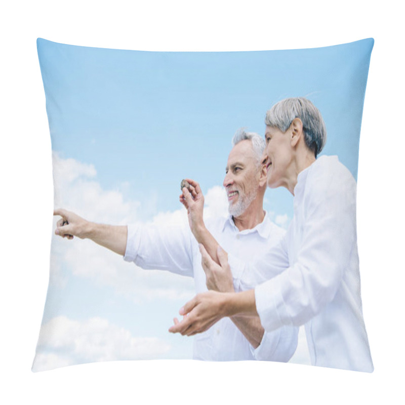 Personality  Happy Smiling Senior Couple Holding Stone And Pointing With Finger Under Blue Sky Pillow Covers