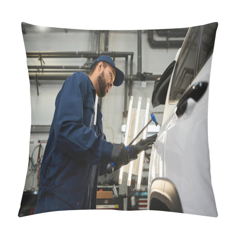 Personality  Handsome Mechanic Focuses Intently On Fixing A Vehicle In A Busy Workshop Setting. Pillow Covers