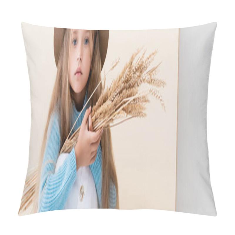 Personality  Fashionable Blonde Girl In Hat, White Skirt And Blue Sweater With Wheat Spikes Sitting On Beige Background, Panoramic Shot Pillow Covers