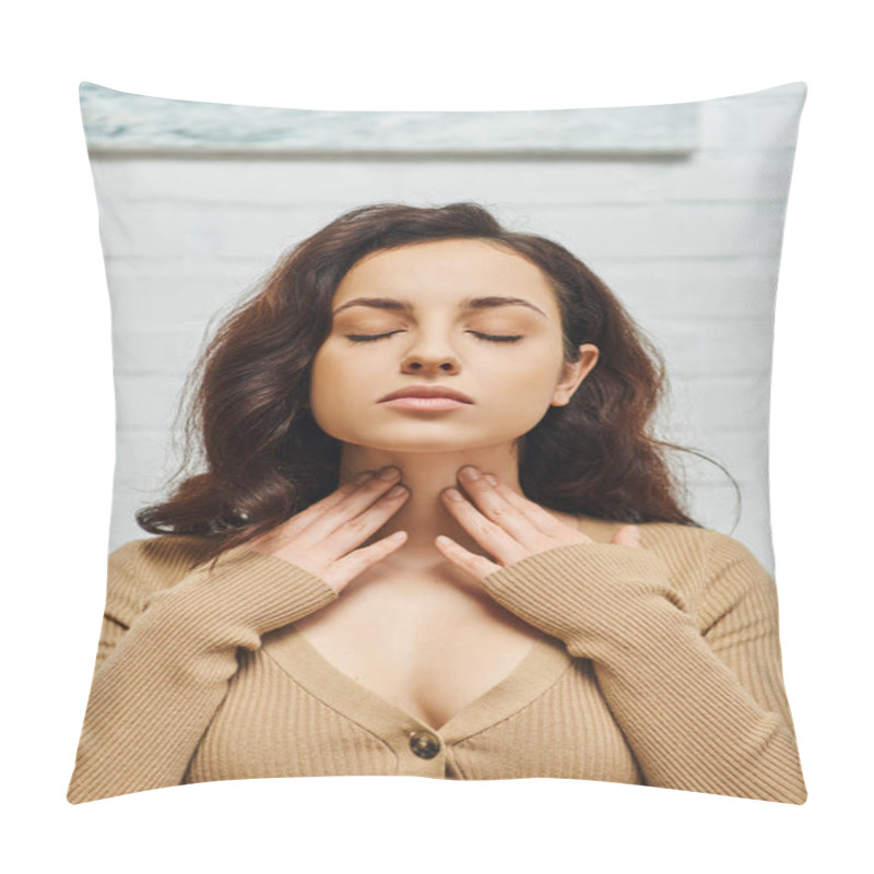 Personality  Portrait Of Young Brunette Woman In Brown Jumper Checking Thyroid Gland On Neck While Sitting With Closed Eyes On Couch In Living Room At Home, Focus On Self-care And Well-being Concept  Pillow Covers