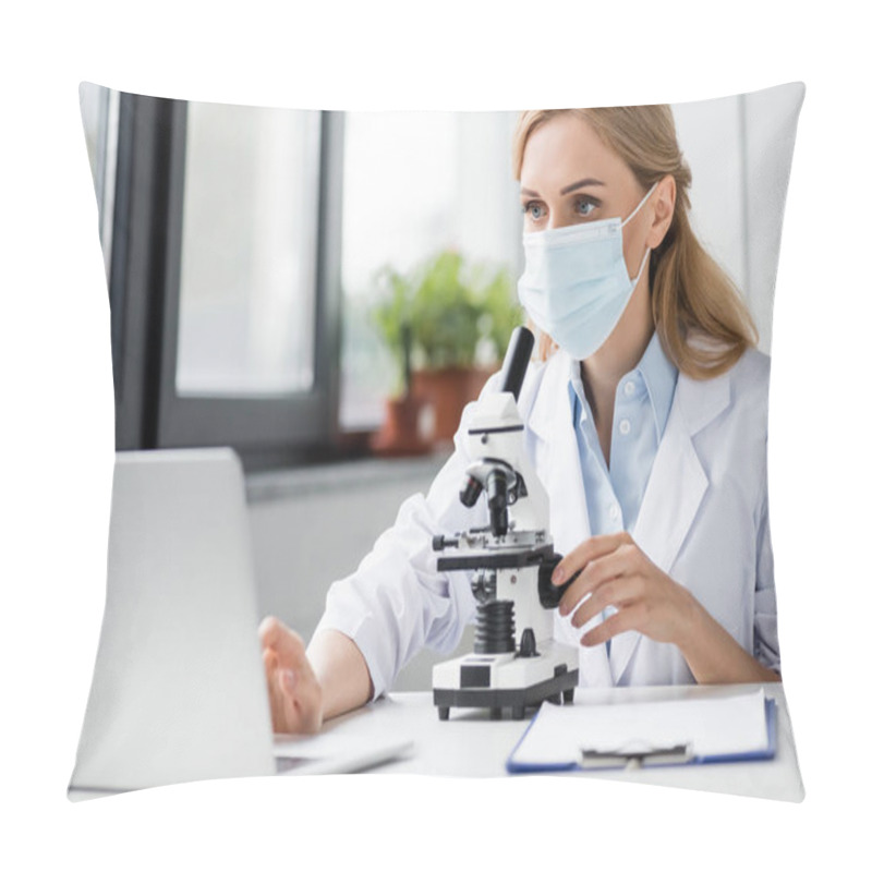 Personality  Specialist In Medical Mask Using Laptop Near Microscope On Desk  Pillow Covers