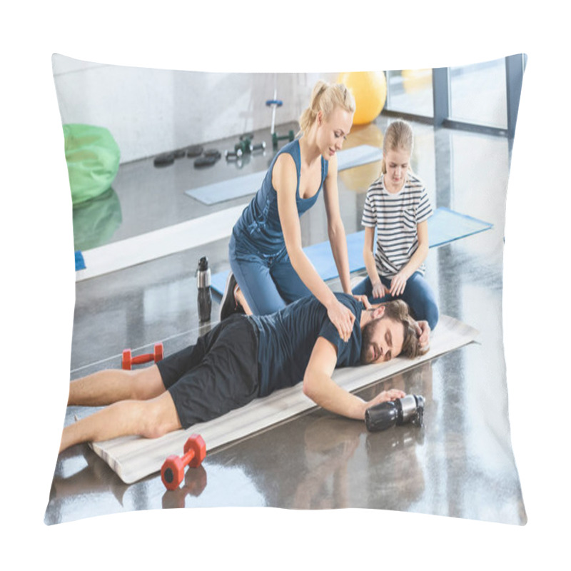 Personality  Woman With Girl Helping Tired Man Lying On Mat At Gym Pillow Covers