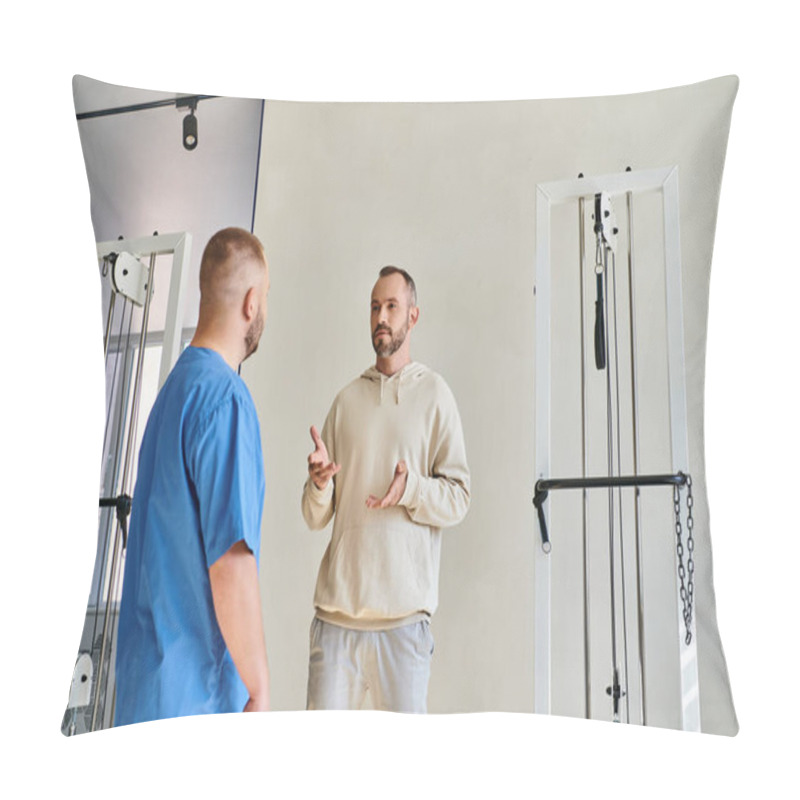 Personality  Male Patient Discussing Treatment Plan With Doctor In Blue Uniform In Recovery Kinesio Center Pillow Covers