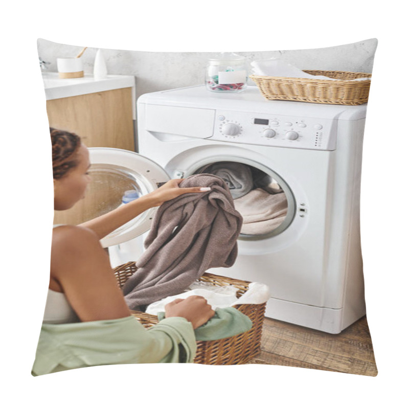 Personality  An African American Woman With Afro Braids Carefully Loads Clothes Into A Washing Machine In A Bathroom. Pillow Covers