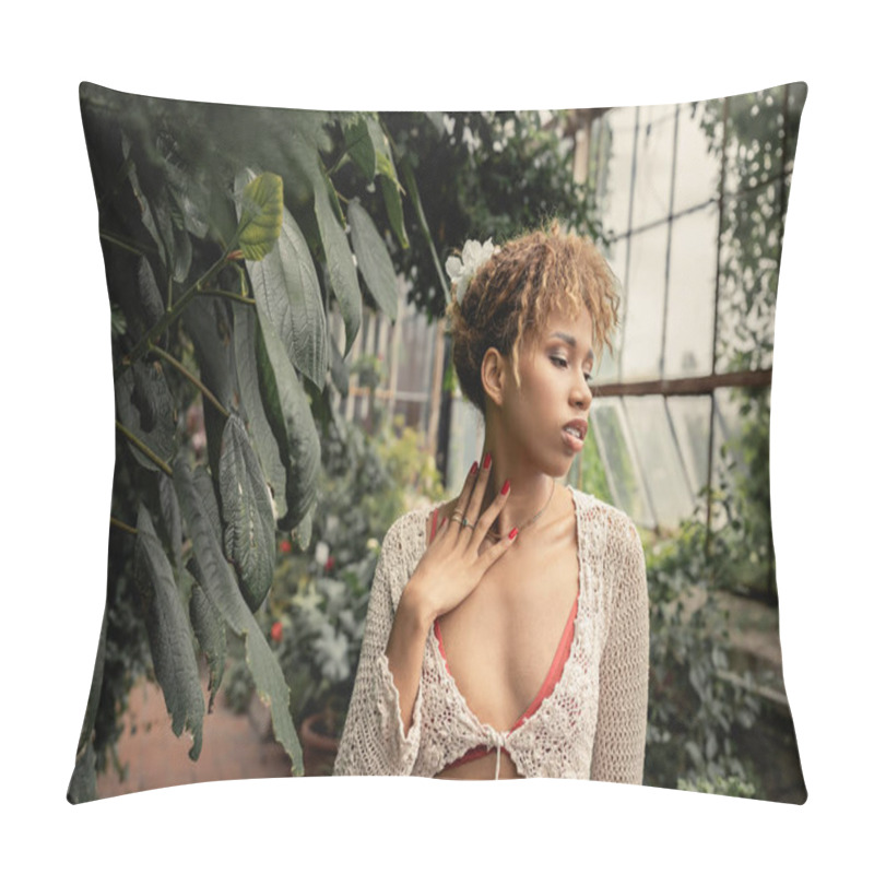 Personality  Trendy Young African American Woman In Summer Outfit And Knitted Top Touching Neck While Standing Near Green Plants In Blurred Indoor Garden At Background, Stylish Lady Surrounded By Lush Greenery Pillow Covers