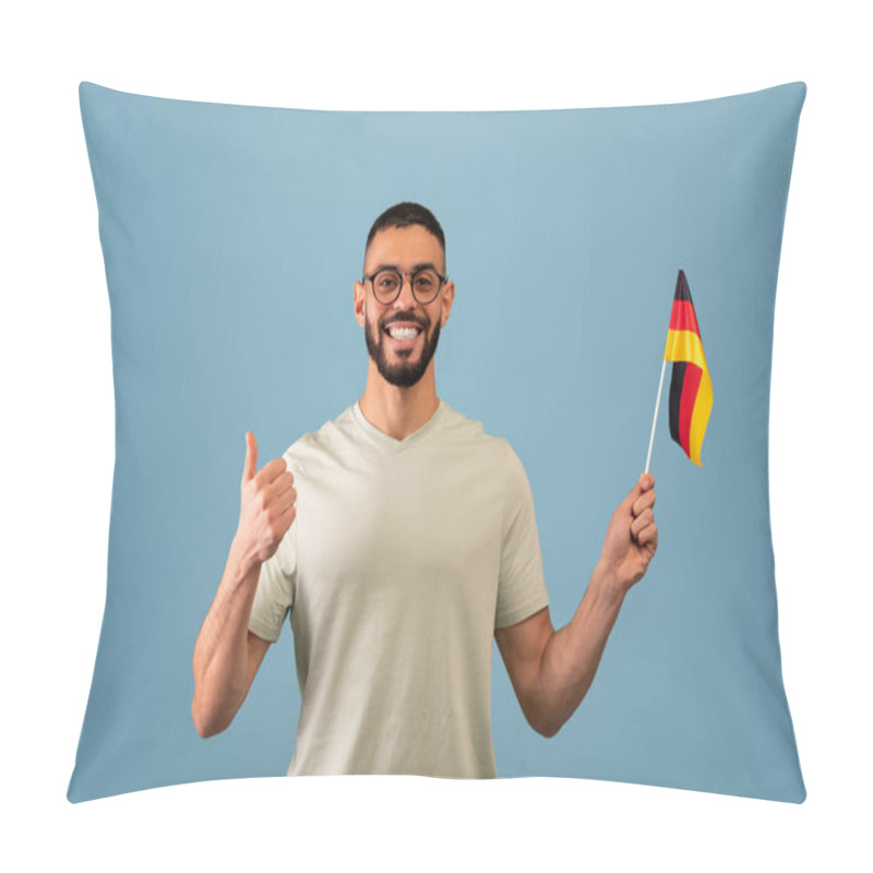 Personality  Happy Arab Guy Showing Thumb Up And Flag Of Germany, Posing Over Blue Studio Background. Education In Germany Pillow Covers