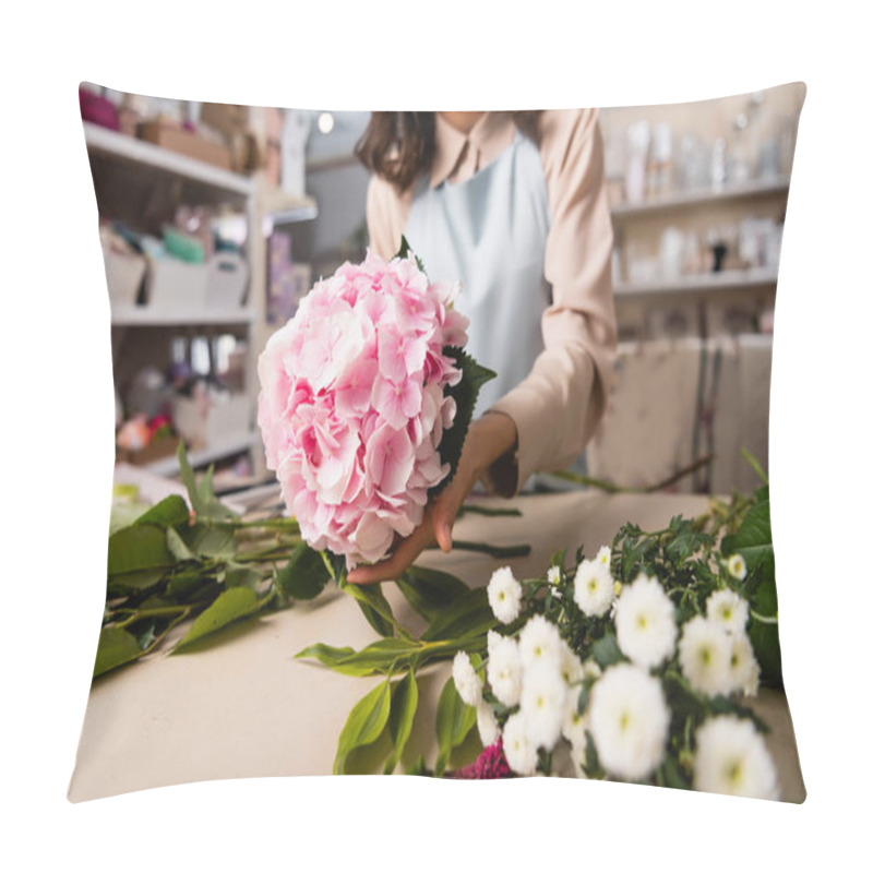 Personality  Close Up View Of Blooming Hydrangea In Hand Of Florist Near Chrysanthemums On Desk On Blurred Background Pillow Covers