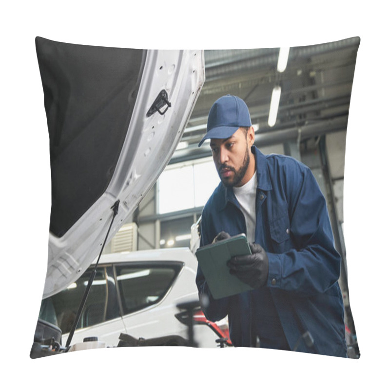 Personality  A Focused Young Mechanic Inspects A Car Engine While Taking Notes In A Busy Auto Repair Shop. Pillow Covers