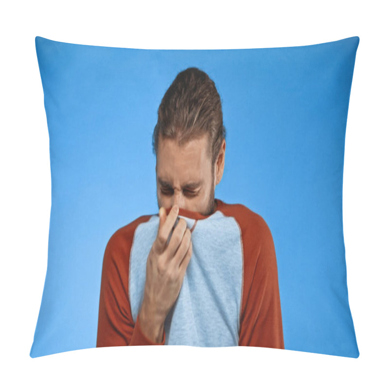 Personality  Young Man Covering Nose With Shirt While Feeling Unpleasant Smell On Blue Pillow Covers