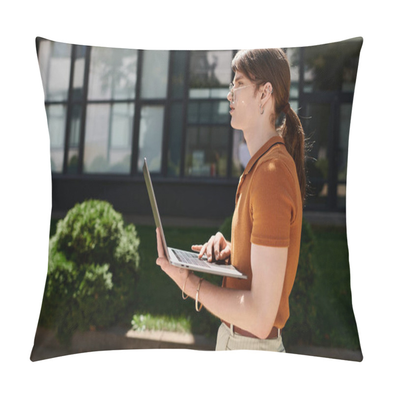 Personality  Focused On Their Laptop, A Young Non Binary Individual Enjoys Working In An Open Office Space. Pillow Covers