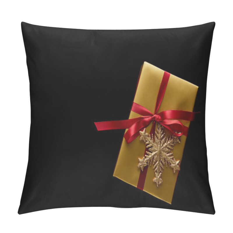 Personality  Top View Of Shiny Golden Christmas Gift With Red Ribbon And Snowflake Isolated On Black Pillow Covers