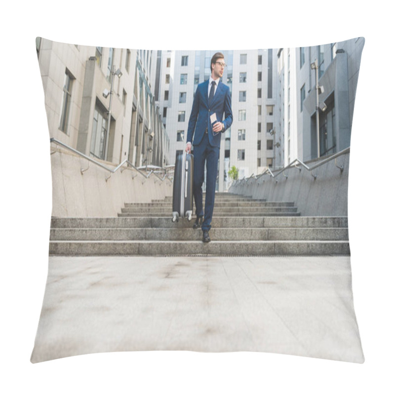 Personality  Attractive Young Businessman In Stylish Suit With Luggage And Flight Tickets Going Down Stairs In Business District Pillow Covers