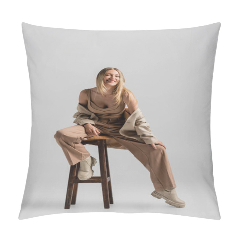 Personality  Cheerful Blonde Woman In Stylish Formal Suit Sitting On Chair And Smiling, Fashion And Style Pillow Covers