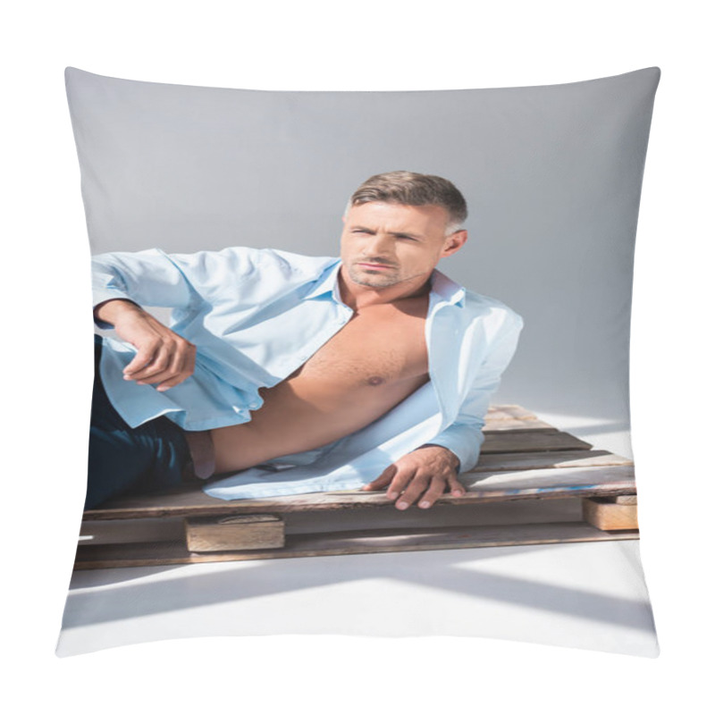 Personality  Handsome Adult Man Lying On Wooden Pallet On White And Looking Away Pillow Covers