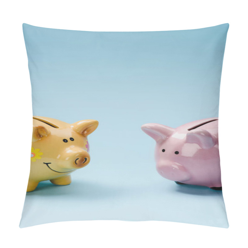 Personality  Close Up View Of Two Yellow And Pink Piggy Banks Isolated On Blue Pillow Covers