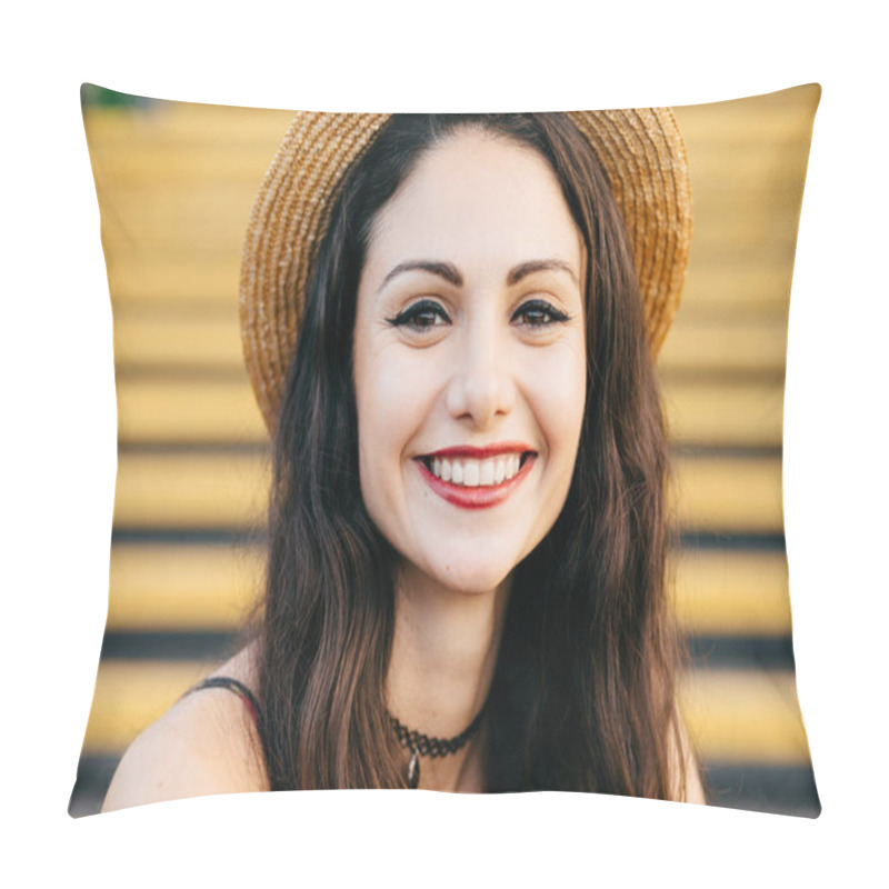 Personality  Young Brunette Woman With Dark Shining Eyes, Well-shaped Lips And Broad Smile Wearing Summer Straw Hat While Sitting At Stairs. Emotional Female Feeling Relaxation. People, Lifestyle Concept Pillow Covers