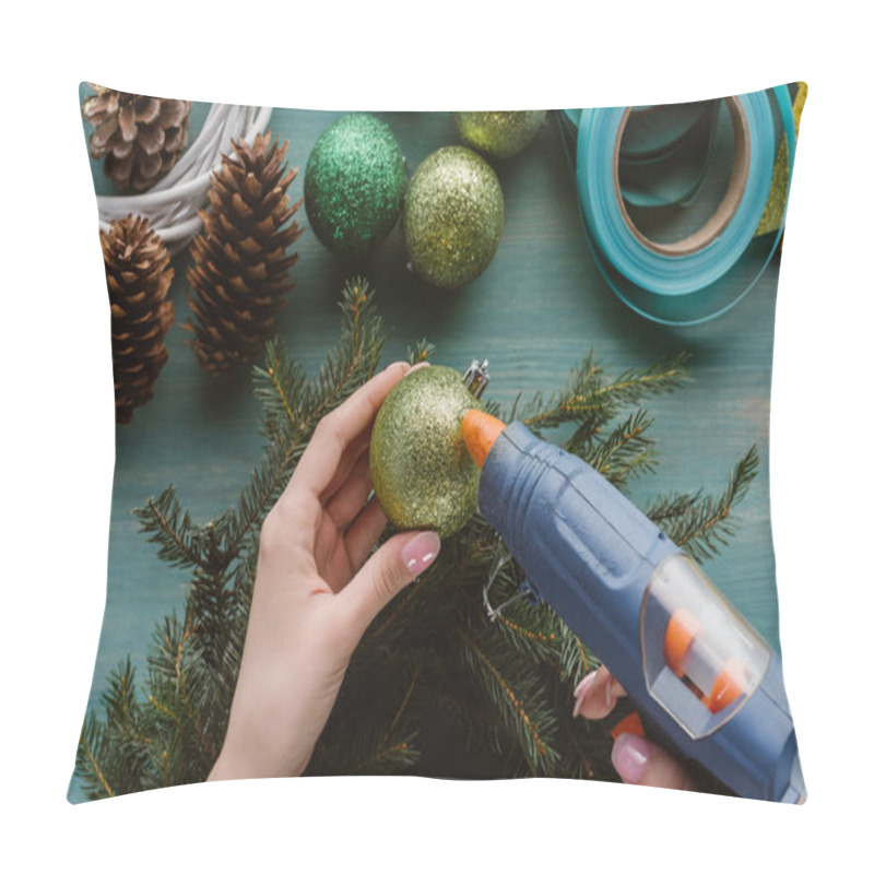 Personality  Partial View Of Woman Decorating Handmade Pine Tree Wreath With Christmas Toys On Blue Wooden Surface Pillow Covers