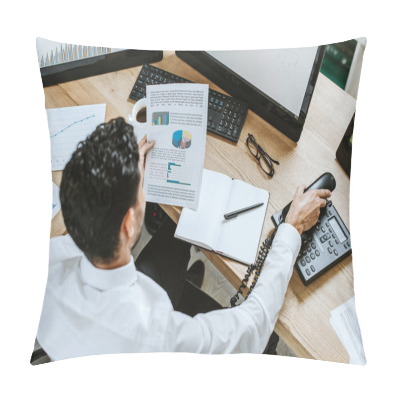 Personality  Overhead View Of Bi-racial Trader Looking At Paper And Holding Handset  Pillow Covers