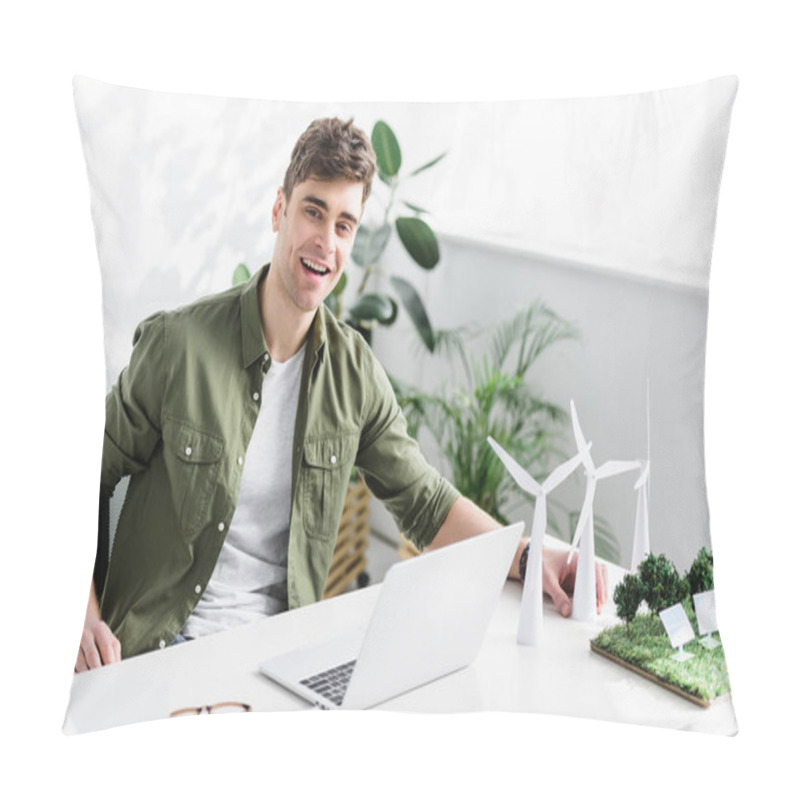 Personality  Handsome Architect Sitting At Table With Laptop, Windmills, Solar Panels Models On Grass And Smiling In Office Pillow Covers