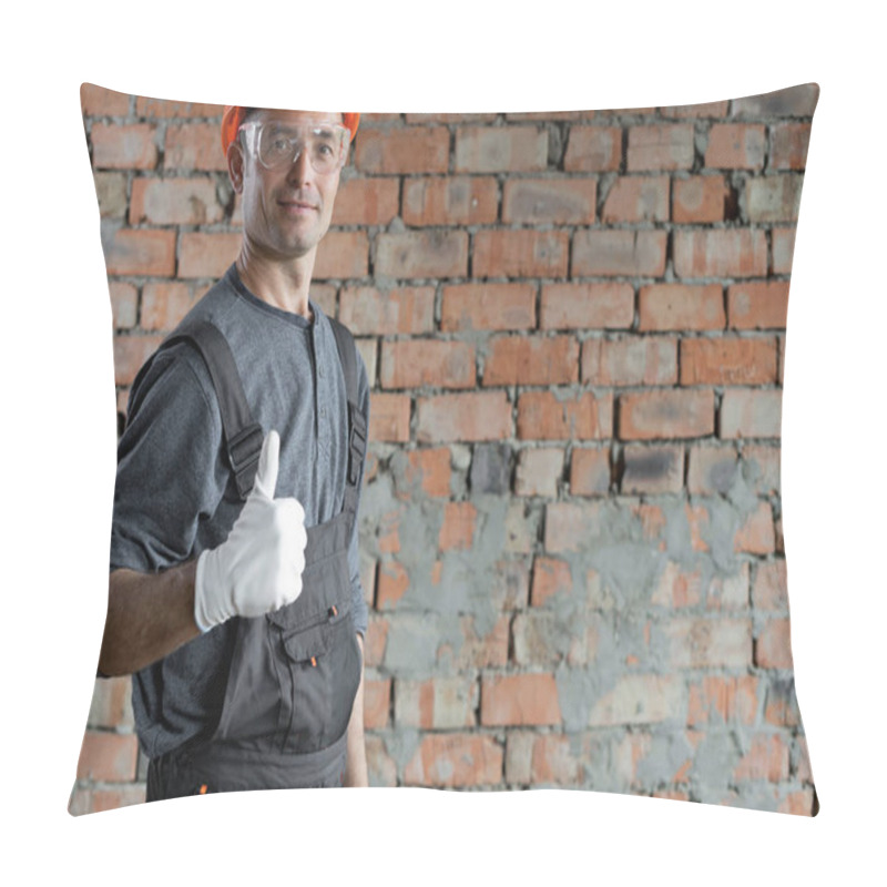 Personality  A Construction Engineer Or An Architect In A Protective Helmet And Glasses Stands Indoors Against A Brick Wall And Raised His Finger Up Shows Cool. Male Foreman. Space For Text. Renovation Concept Pillow Covers